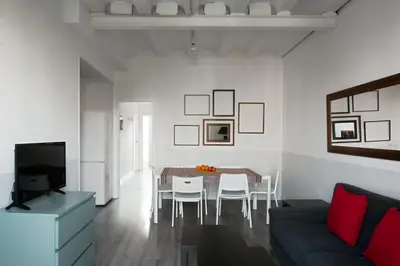 a living room with a table and a couch at My Address in Barcelona Old Town in Barcelona