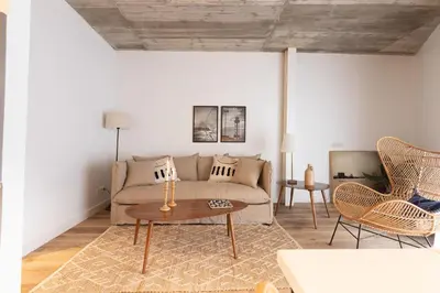 a living room with a couch and a table at En Casa de Calders 5 in Barcelona
