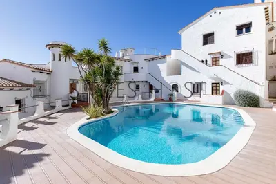 a swimming pool in front of a house at Sitges Blue - completamente reformado en 2025 in Sitges