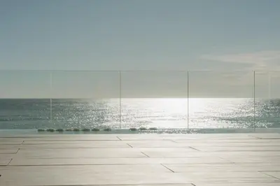an empty room with a view of the ocean at Playa Grande by Tropical in Gavà