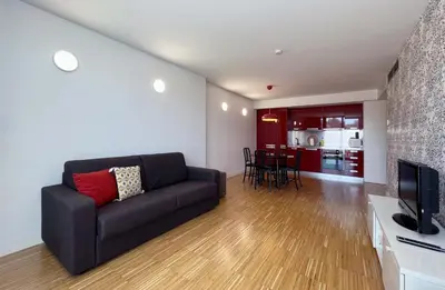 a living room with a couch and a television at Stay U-nique Apartments Pellaires in Barcelona