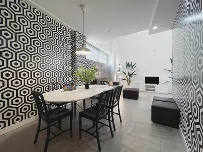 a dining room with a table and chairs at Stay U-nique Apartments Pellaires in Barcelona