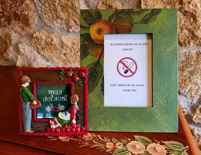 a box with a picture of a sign with a no smoking sign at MAS DEL VENT- Barbacoa, jardín, piscina privada y vistas a mar in Cunit
