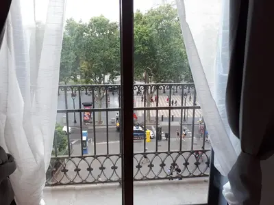 a view of a city street from a window at Beautiful Apartment on Las Ramblas with Port views in Barcelona