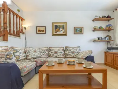 a living room with a couch and a coffee table at Holiday Home Envalira by Interhome in Cunit