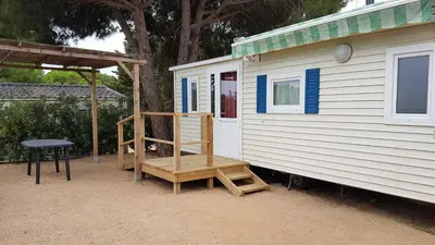 a tiny house with a ladder on the side of it at El Carlitos in Arenys de Mar