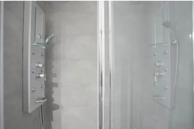 a bathroom with a shower with a glass door at Nordic apartment Sagrada Familia in Barcelona