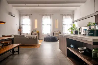 a living room with a couch and a table at Poble Nou I You Stylish Apartments in Barcelona