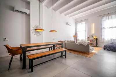 a living room with a table and a couch at Poble Nou I You Stylish Apartments in Barcelona
