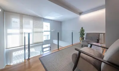 a living room with a large window and a couch at Poble Nou II You Stylish Apartments in Barcelona