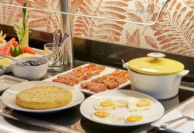 a table with plates of food on a counter at The Moods Oasis in Barcelona