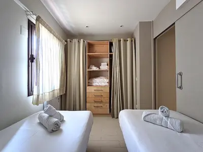 a bedroom with two beds and a closet at ClassBedroom Gothic Ramblas Apartments in Barcelona