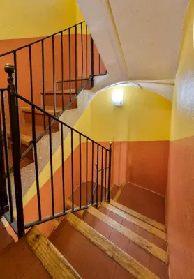 a spiral staircase in a building with a stair railing at ClassBedroom Gothic Ramblas Apartments in Barcelona