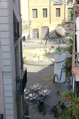 a view of a courtyard with tables and chairs at ClassBedroom Gothic Ramblas Apartments in Barcelona