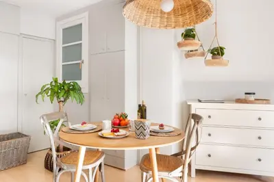a dining room with a table with fruit on it at El Alma de las Ramblas in Barcelona