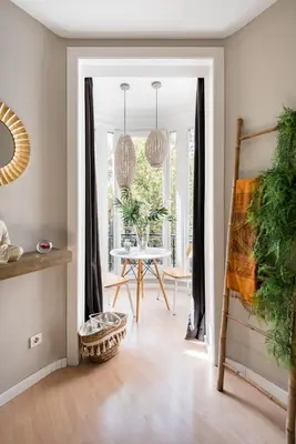 a living room with a table and a dining room at El Alma de las Ramblas in Barcelona