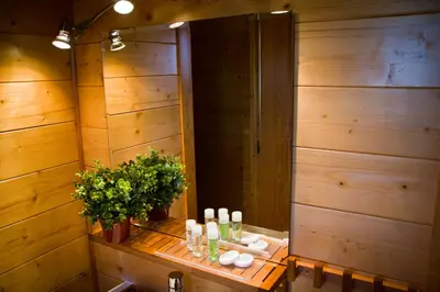 a bathroom with a table with a sink and a mirror at Refugio cálido,estilo nórdico el Bosquet in Sant Cugat del Vallès