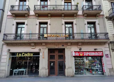 a building with balconies on top of it at Hostal Live Barcelona in Barcelona