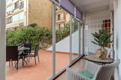 a balcony with a table and chairs and a table at AB Passeig de Gràcia Còrsega in Barcelona