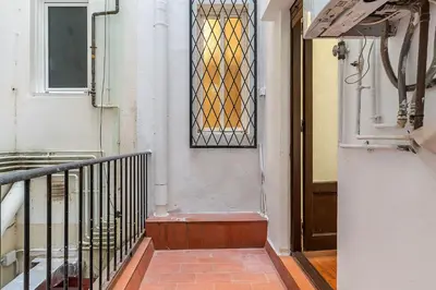 an entrance to a building with a door and a window at AB Passeig de Gràcia Còrsega in Barcelona