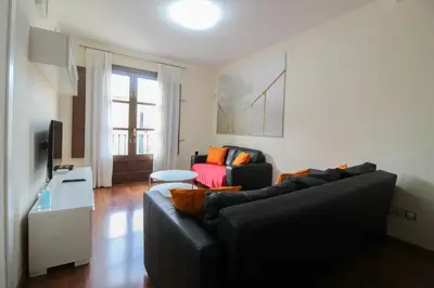 a living room with a couch and a table at Girona 108 in Barcelona