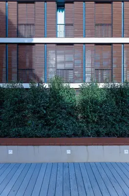 a building with bushes in front of a building at Hotel Raval House in Barcelona
