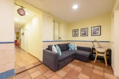 a living room with a couch and a table at RamblasRentals Chic & Spacious Flat Pool Table 15M Ramblas - Parking - Wifi in Barcelona