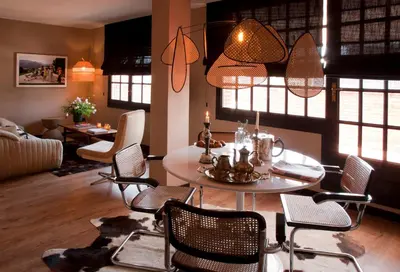a living room with a table and chairs at Isabella's House in Barcelona