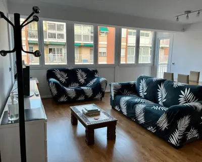 a living room with two couches and a coffee table at Amplio Apartamento cerca de FIRA y del Centro in Hospitalet de Llobregat