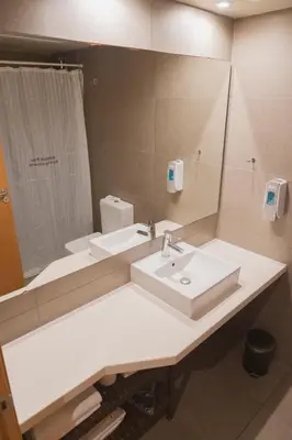 a bathroom with a sink and a mirror at Apartments Hotel Sant Pau in Barcelona
