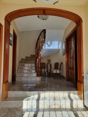 an archway leading to a staircase in a house at Cal Llopet in Can Cartro