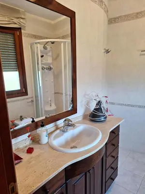 a bathroom with a sink and a mirror at Cal Llopet in Can Cartro