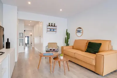 a living room with a couch and a table at Sweett - Verdi in Barcelona