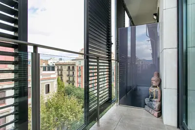 a balcony with a view of the city from a building at Stay U-nique Apartments Plaça de Tetuan in Barcelona