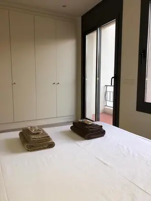 two towels are sitting on top of a bed at Calella Playa Vistas Mar in Calella