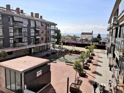 a view of a city with buildings and a playground at Calella Playa Vistas Mar in Calella