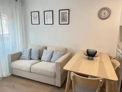 a living room with a couch and a table at Beach apartment IV Coeur de Plage in Castelldefels