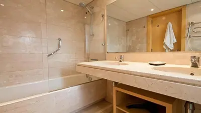 a bathroom with a sink and a shower and a tub at Spacious Duplex in Barcelona with outdoor terrace - 180 m² in Barcelona