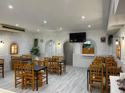 a restaurant with tables and chairs in a room at Hostal Restaurante Avenida de Madrid in Terrassa