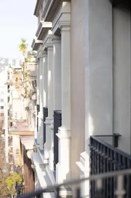 a row of white columns on a building at Occidental Diagonal 414 in Barcelona