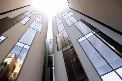 a view of two tall buildings with their windows at Occidental Diagonal 414 in Barcelona