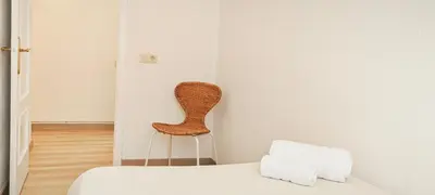 a dining room with a table and a television on a desk at Barcelona - Art in Barcelona