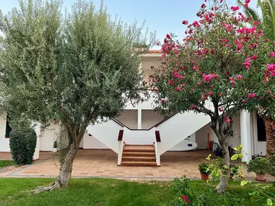 a house with two trees in the yard at Vistas Del Mar by Hello Homes Sitges in Sitges