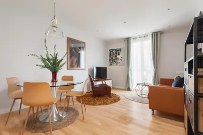 a living room with a table and chairs at Art House Paral-lel Sant Antoni in Barcelona