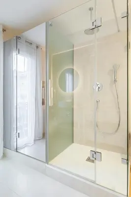 a bathroom with a shower with a glass door at Art House Paral-lel Sant Antoni in Barcelona