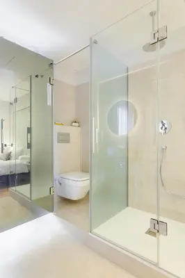 a glass shower in a bathroom with a toilet at Art House Paral-lel Sant Antoni in Barcelona