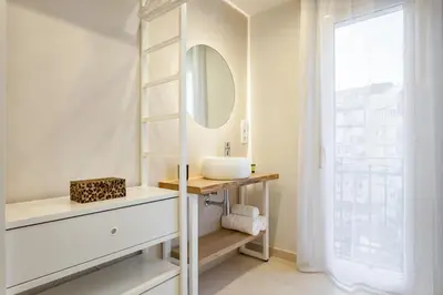 a bathroom with a sink and a mirror at Art House Paral-lel Sant Antoni in Barcelona