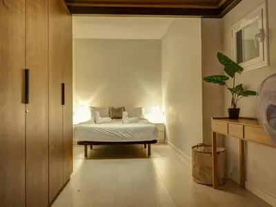 a bedroom with a bed in a room at En Vogue by Hello Homes Sitges in Sitges