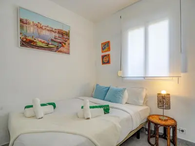 two twin beds in a room with a window at Marina Duplex by Hello Homes Sitges in Sitges