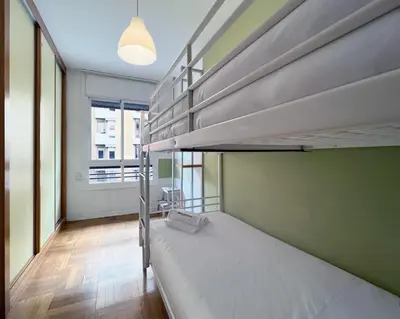 a room with two bunk beds and a window at Stay U-nique Apartments Diagonal in Barcelona